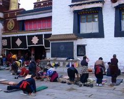 Tibetan Pilgrims Prostrating at Jokhang Temple
