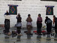 Pilgrims are prostrating in the Jokhang Monastery 